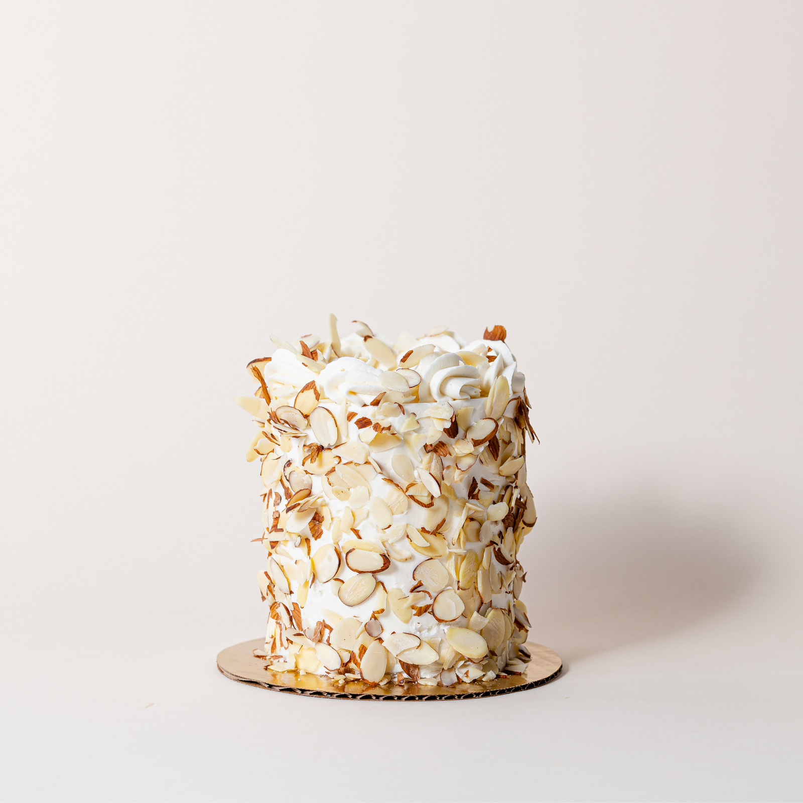 Almond cake coated in thin sliced almonds