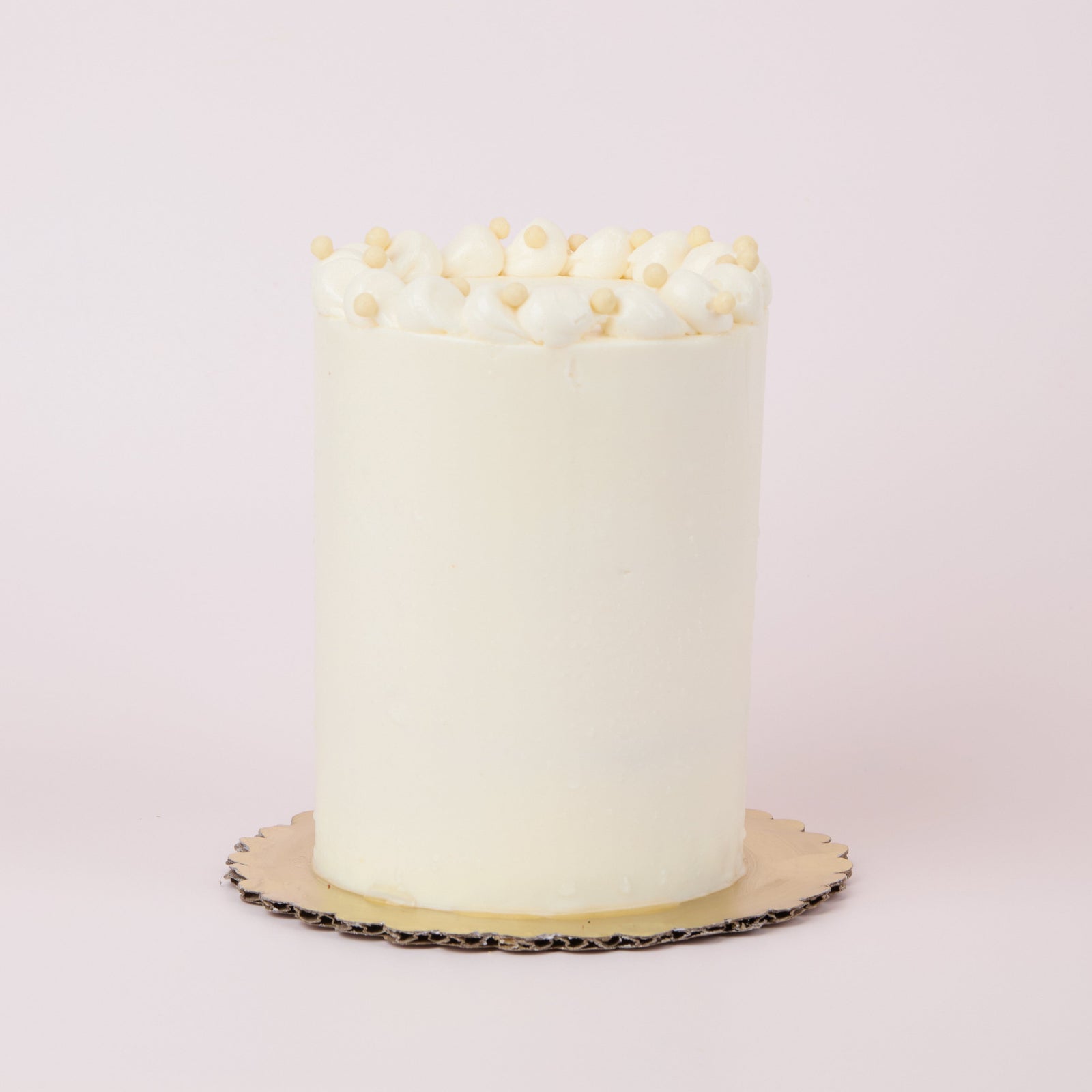 Vanilla bean cake iced in smooth vanilla buttercream