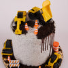 Construction-themed birthday cake with toy dump trucks and traffic cones on a white background